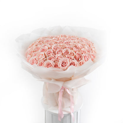 Grand 100 peach rose bouquet in luxury nude-toned wrapping