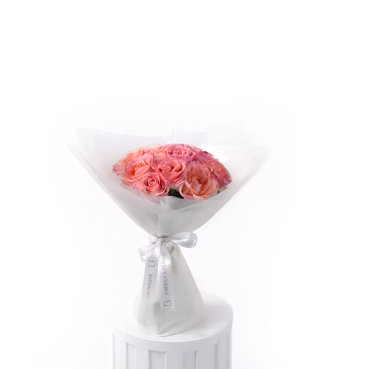 Elegant 12 roses bouquet wrapped in white luxury paper for sale in Dubai