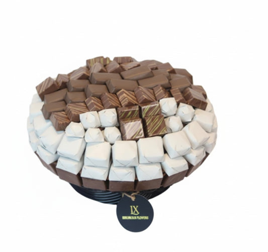 Assorted chocolate with white cover platter with a visible brand tag on a white background