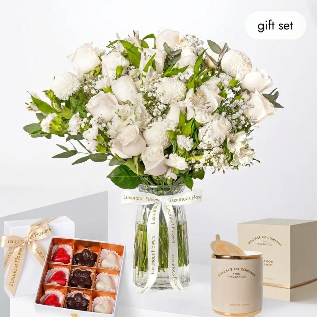 Floral arrangement with a box of chocolates and a candle on a white background, labeled 'gift set'.
