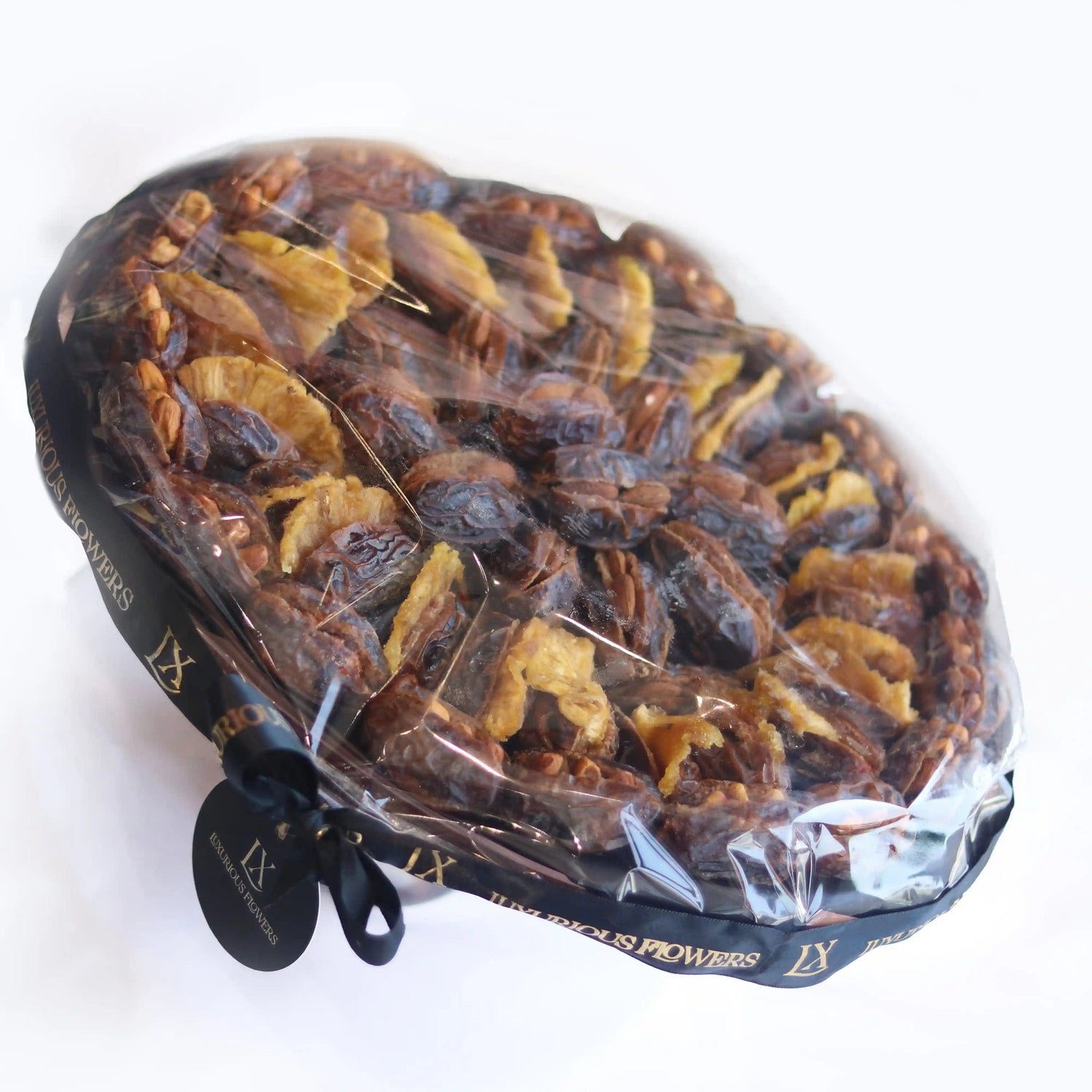 Packaged dried fruit mix dates on a white background