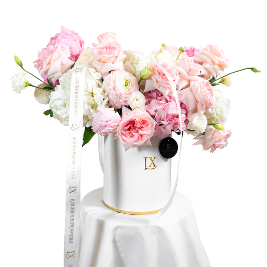 Luxury flower arrangement in a white LX box with pink and white roses, perfect for elegant Dubai floral gifts.