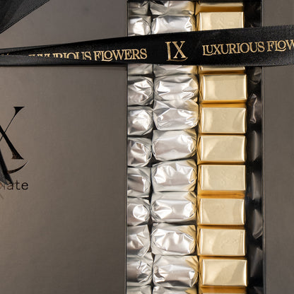 Packaged chocolates in gold and silver wrappers with 'Luxurious Flowers' branding.