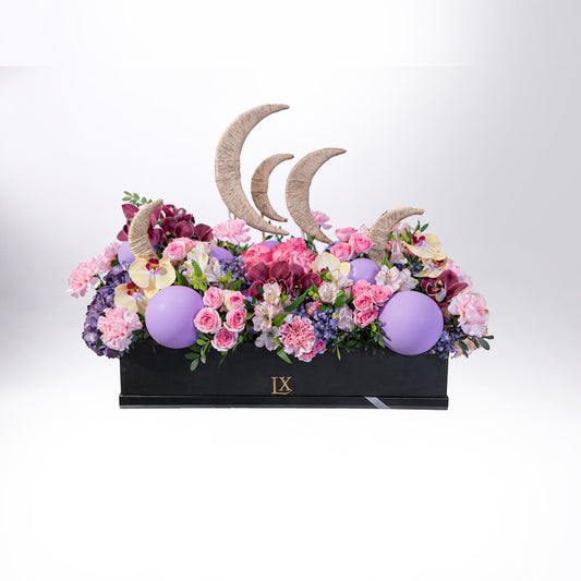 Luxury Ramadan crescent floral arrangement with roses, orchids and decorative moon accents in black box – Dubai flower delivery