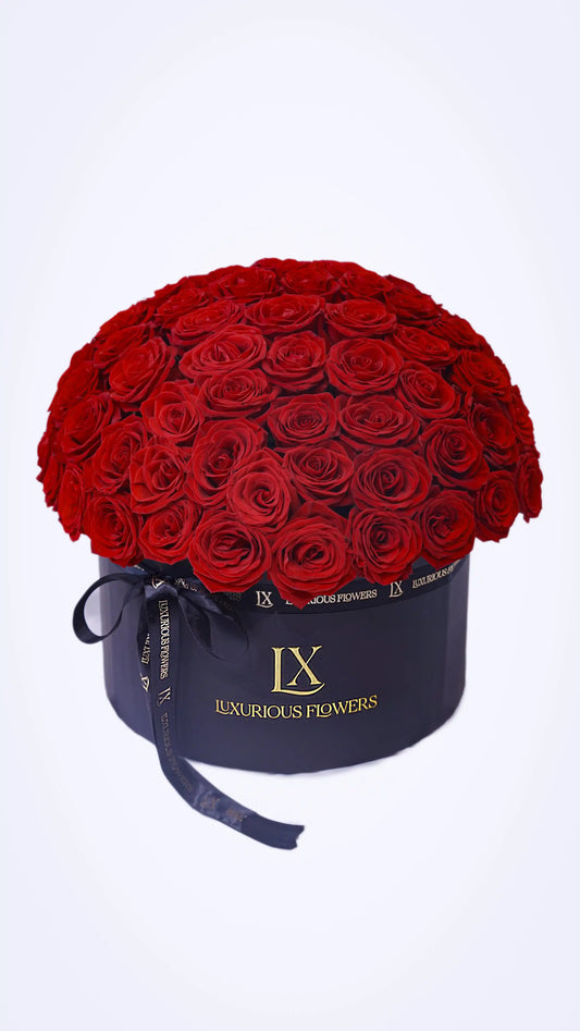 Elegant Passion Bouquet featuring premium red roses wrapped in black luxury paper by Luxurious Flowers