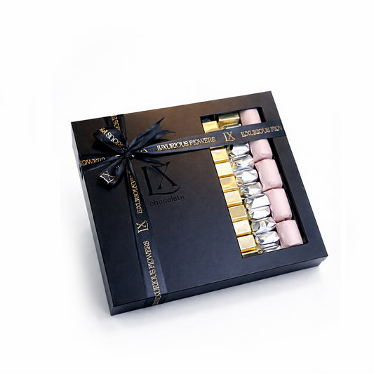 Luxury assorted chocolate gift box in black signature packaging with gold, silver and blush wrapped chocolates – Luxurious Flowers Dubai