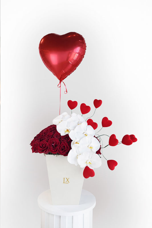 Luxury rose box with red roses, white orchids, and heart balloon by Luxurious Flowers Dubai for sale