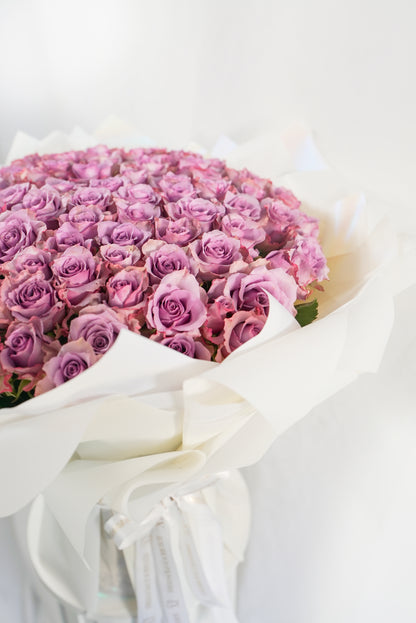 Detailed view of antique mauve rose petals in a 100-stem arrangement