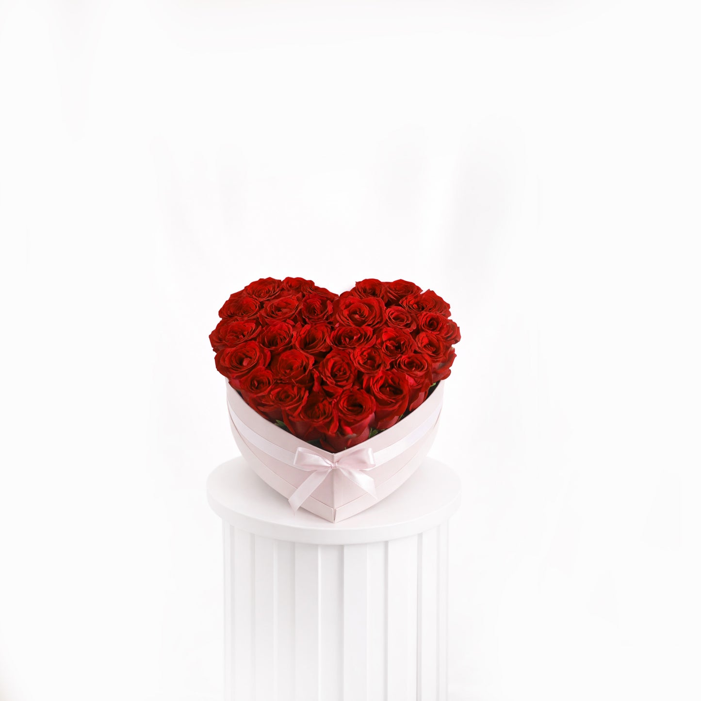 red-roses-in-heart-box with premium red roses arranged elegantly for sale in Dubai
