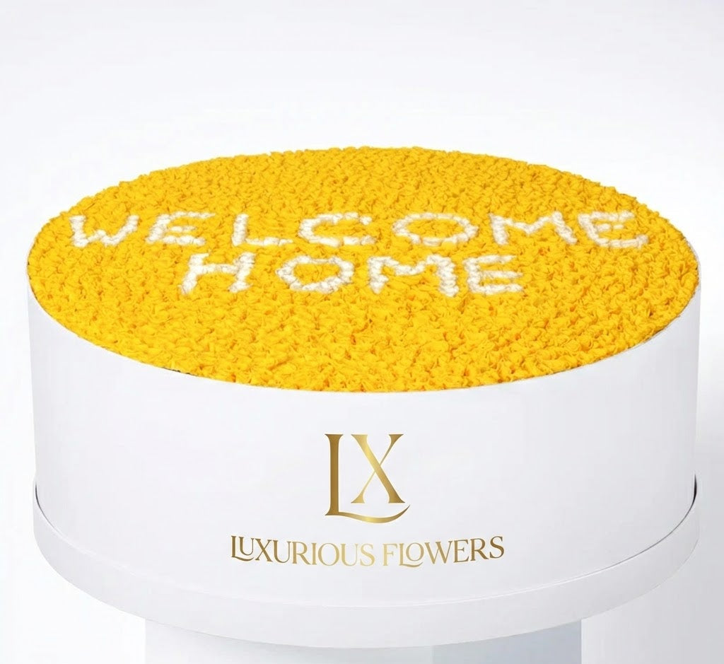Round yellow cushion with 'Welcome Home' text on a white background, featuring the Luxurious Flowers logo.