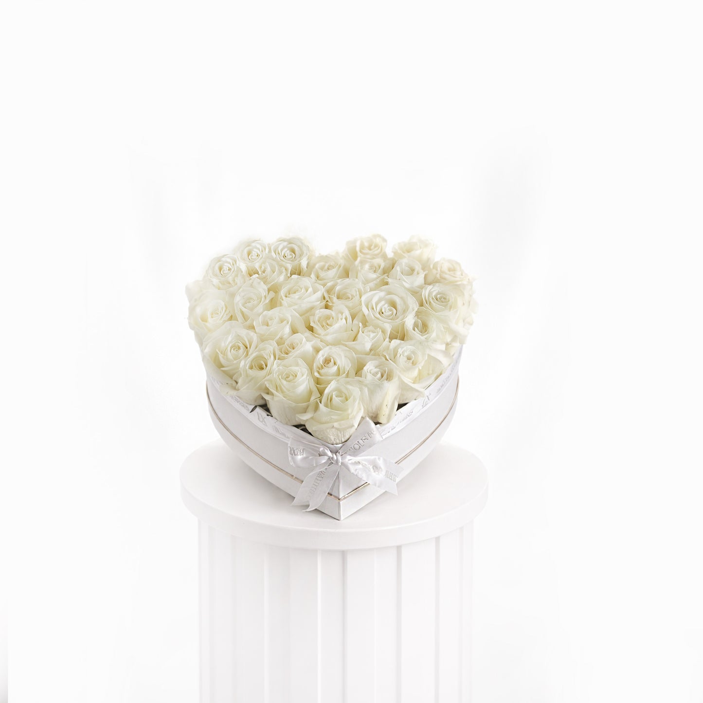 Heart-shaped heart box with premium white roses arranged elegantly for sale in Dubai