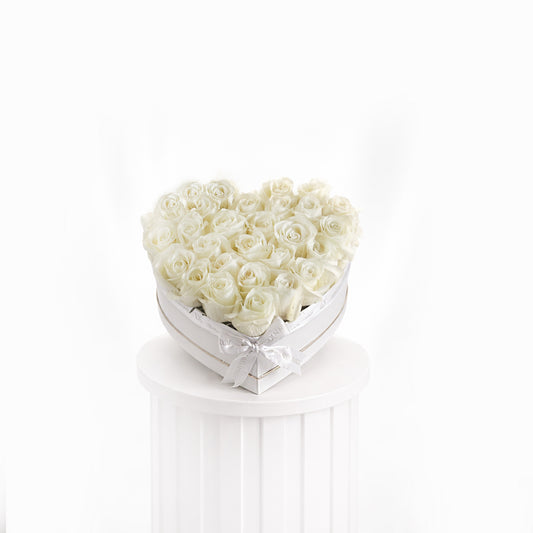 Heart-shaped heart box with premium white roses arranged elegantly for sale in Dubai