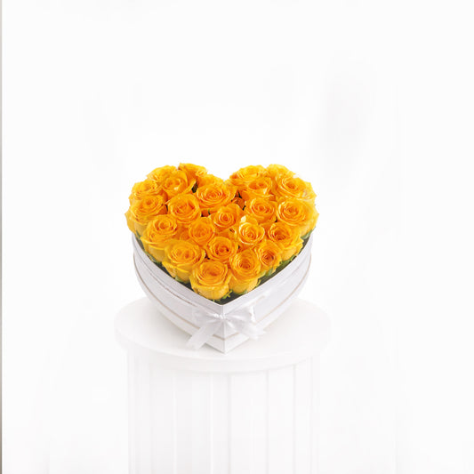 Heart-shaped heart box with premium yellow roses arranged elegantly for sale in Dubai